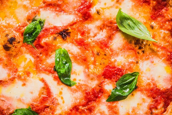 Pizza Margherita background close up.True delicious Italian pizza background