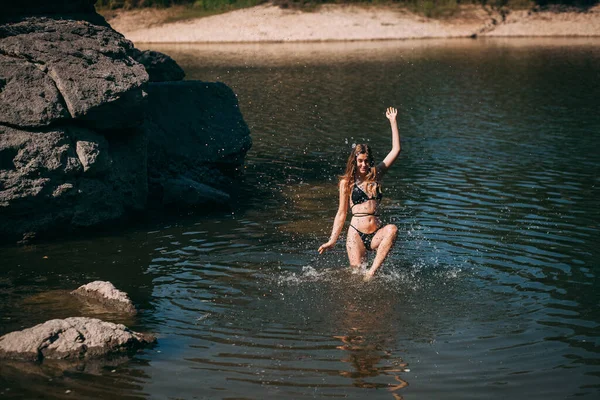 Young Girl Long Blond Hair Slender Figure Black Swimsuit Jumps — Stock Photo, Image