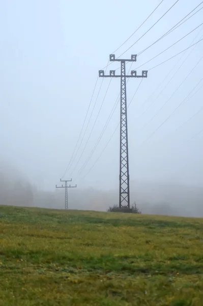 Power Line Towers Submerged Fog Field — Photo