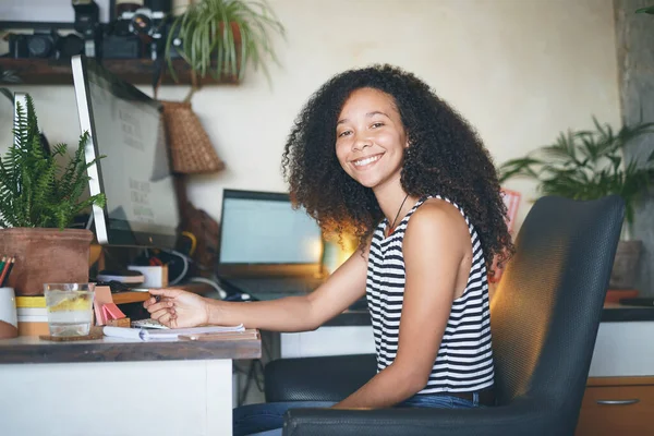 Confident young businesswoman smiling in her home office — 스톡 사진