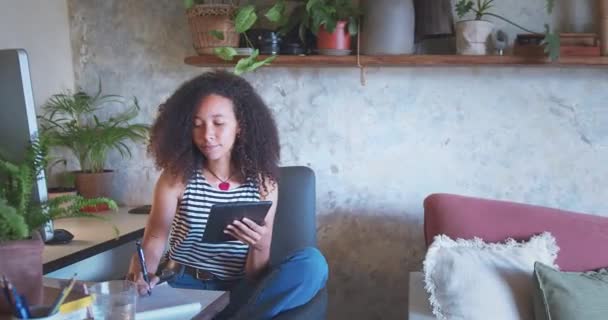 Shot Attractive Young Woman Sitting Alone Using Her Tablet While — Vídeo de Stock