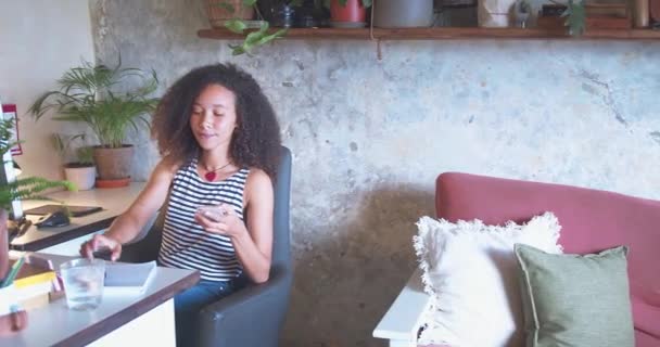 Shot Attractive Young African Woman Sitting Alone Making Notes Her — Stockvideo