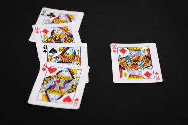 Conceptual layout of playing cards with queen and king facing each other