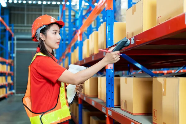 Female Worker Protective Vest Scanner Holds Document Standing Warehouse Freight Royaltyfria Stockfoton