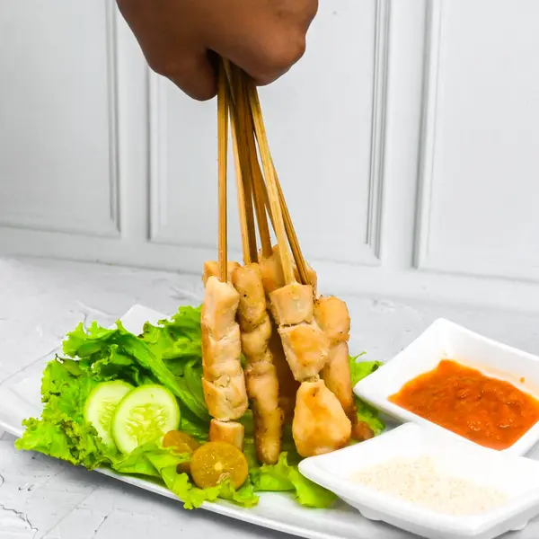 Sate Taichan, Grilled Chicken Satay without peanut sauce or soy sauce. Served on plate with sambal (chilli sauce). Selected focus.