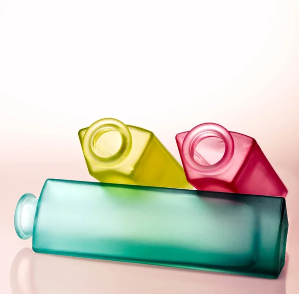 Elongated Bottle Decorative Yellow Pink Green Opaque Glass White Background — Stockfoto