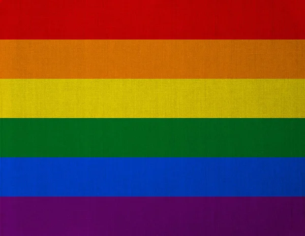 Gey gurur bayrağının gökkuşağı renkleri keten bir dokuya örtülmüş.