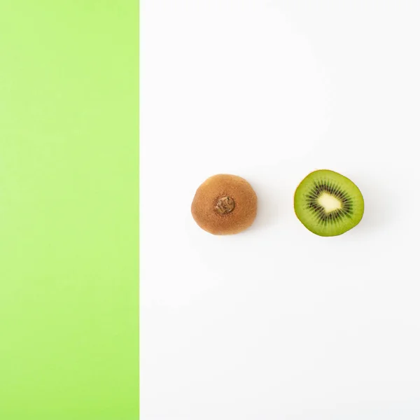Minimal food layout made with fresh sliced fruit on bright background. Modern natural aesthetic.