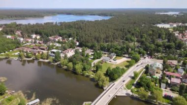 Panorama of Augustow from the drone.View of the Augustow Canal and cruise ships and sailboats sailing on it on a sunny,summer day.