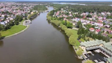 Panorama of Augustow from the drone.View of the Augustow Canal and cruise ships and sailboats sailing on it on a sunny,summer day.