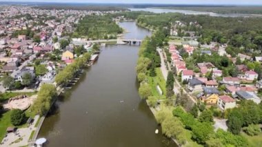 Panorama of Augustow from the drone.View of the Augustow Canal and cruise ships and sailboats sailing on it on a sunny,summer day.