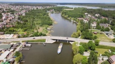 Panorama of Augustow from the drone.View of the Augustow Canal and cruise ships and sailboats sailing on it on a sunny,summer day.