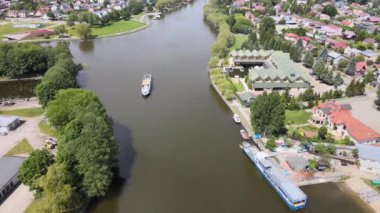 Panorama of Augustow from the drone.View of the Augustow Canal and cruise ships and sailboats sailing on it on a sunny,summer day.