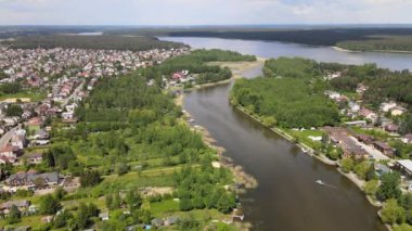 Panorama of Augustow from the drone.View of the Augustow Canal and cruise ships and sailboats sailing on it on a sunny,summer day.
