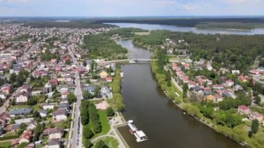Panorama of Augustow from the drone.View of the Augustow Canal and cruise ships and sailboats sailing on it on a sunny,summer day.