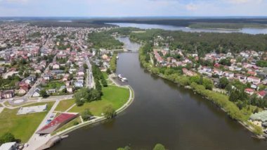Panorama of Augustow from the drone.View of the Augustow Canal and cruise ships and sailboats sailing on it on a sunny,summer day.