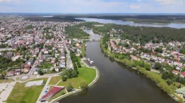 Panorama of Augustow from the drone.View of the Augustow Canal and cruise ships and sailboats sailing on it on a sunny,summer day.