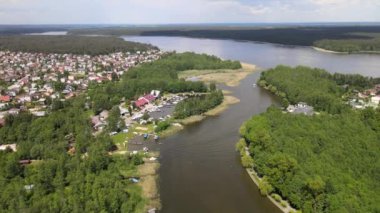 Panorama of Augustow from the drone.View of the Augustow Canal and cruise ships and sailboats sailing on it on a sunny summer day.