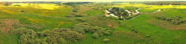 Panorama from the drone to the hermitage of orthodox monks.Orthodox building-Skit located in the valley of the Narew River surrounded by a moat.