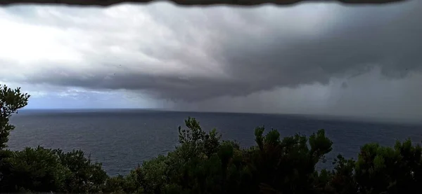 Thunderstorm over the ocean as seen from the whale watching house on Terceira Island June 2022