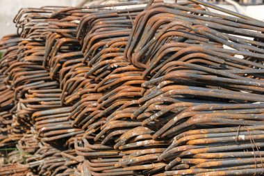Steel bars are materials for use in construction piled together on the floor