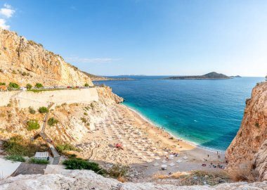 Antalya, Turkey - summer 2021: Aerial view of the popular and touristic sandy beach of Kaputas. Mediterranean coast. Turquoise sea water. Sunny weather.