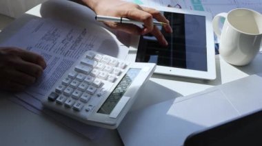 Use calculator for financial planning.