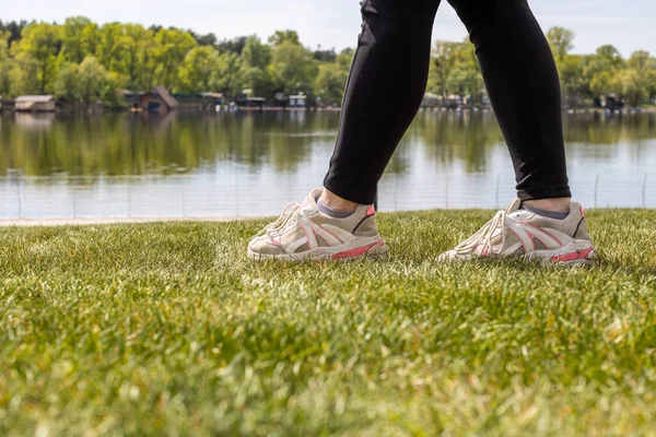 Women Legs Sneakers Grass River Closeup — Foto de Stock