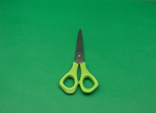 Green Scissors Isolated Green Background Close — ストック写真