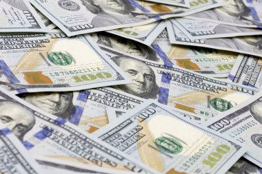 Background of one hundred dollar bills. Closeup one hundred dollar bills