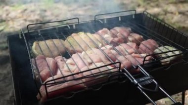 Meat on the grill close-up. Barbecue in the forest