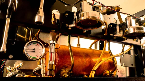 Inside coffee machine of espresso machine. Repairing of broken coffee machine.