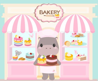 Tatlı pastane vitrininde her çeşit pasta, pasta, turta ve çilekli önlüklü tatlı bir hipopotam var.