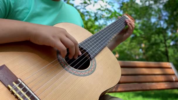 Hands Young Man Fingering Strings Classical Guitar Outdoor Park Hands — Vídeos de Stock