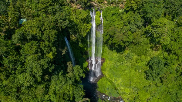 Waterfall in green rainforest. Breathtaking aerial view of triple waterfall Sekumpul in the mountain jungle. Bali,Indonesia. Travel concept. . High quality photo