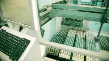 Automated laboratory for blood testing. Moving line with test tubes. PCR Test Covid 19, Antibody test