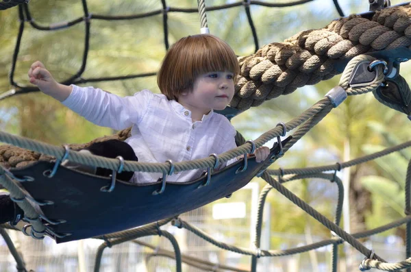 Cute Boy White Shirt Lies Hammock Grid Playground Rope Park — Stock Photo, Image