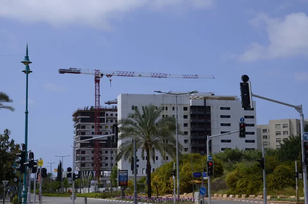 Modern building in Israel. Construction work site. Building yard of Housing construction of houses in a new area of the city.  The site with cranes