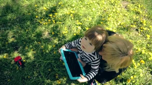 Little Boy Striped Shirt Sits Shoulders Blonde Mom Family Admires — Vídeo de stock