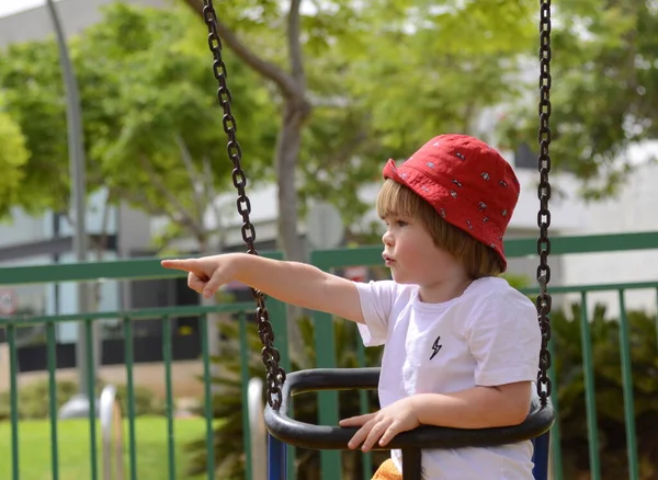 Little Boy Red Panama Hat Rides Swing Playground Summer Colorful — Stock Photo, Image