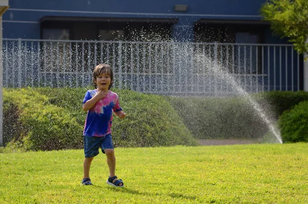 Little Boy Playing Garden Sprinkler Preschooler Boy Running Jumping Summer — Stockfoto