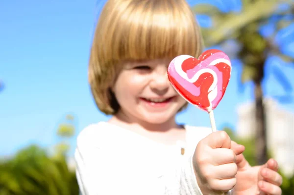 Portrait Cute Positive Little Boy Heart Shaped Candy Concept Mother — Stok fotoğraf