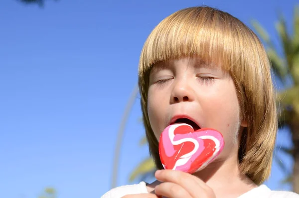 Portrait Cute Positive Little Boy Heart Shaped Candy Concept Mother — Foto de Stock