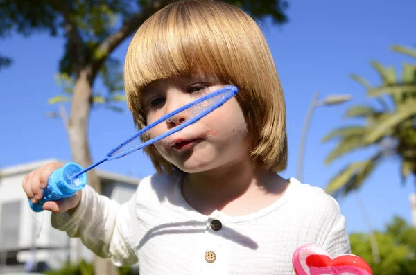 Cute Boy Blowing Soap Bubbles Children Entertainment Games — Stockfoto
