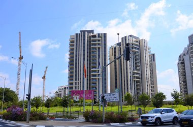 Israel Rishon LeZion August 2022 Beautiful residential building. Modern housing. Israel - high-rise building, flowering trees. Concept: nice place to live, real estate purchase