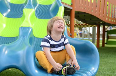 Portrait of a crying boy. Little cute boy is naughty. The child is naughty, screaming, crying in the street. The children want a toy.
