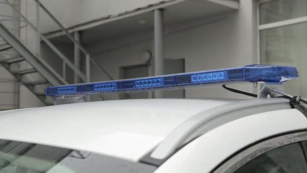 Raindrops Reflect Blue Flashing Lights Top Police Car Roof Car — Wideo stockowe