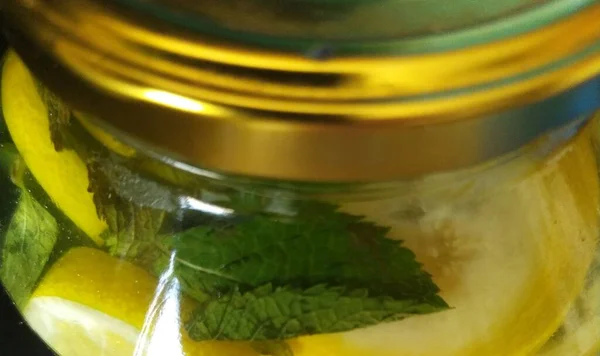 Glass Jar Lemon Juice Fresh Green Mint Golden Cover Close — Stockfoto