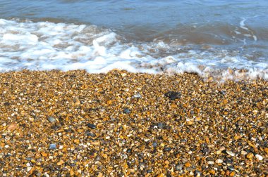 Ocean Wave Washes Over Sand and Pebble Beach, Incoming Tide, full frame, no people, concept or design,background, wallpaper, 