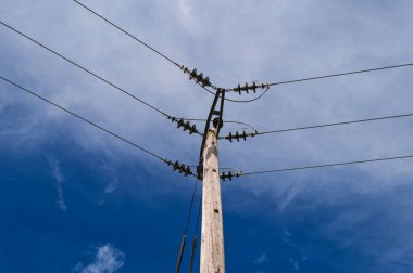 Wooden power pole, high voltage electricity, power supply and demand, energy crisis
